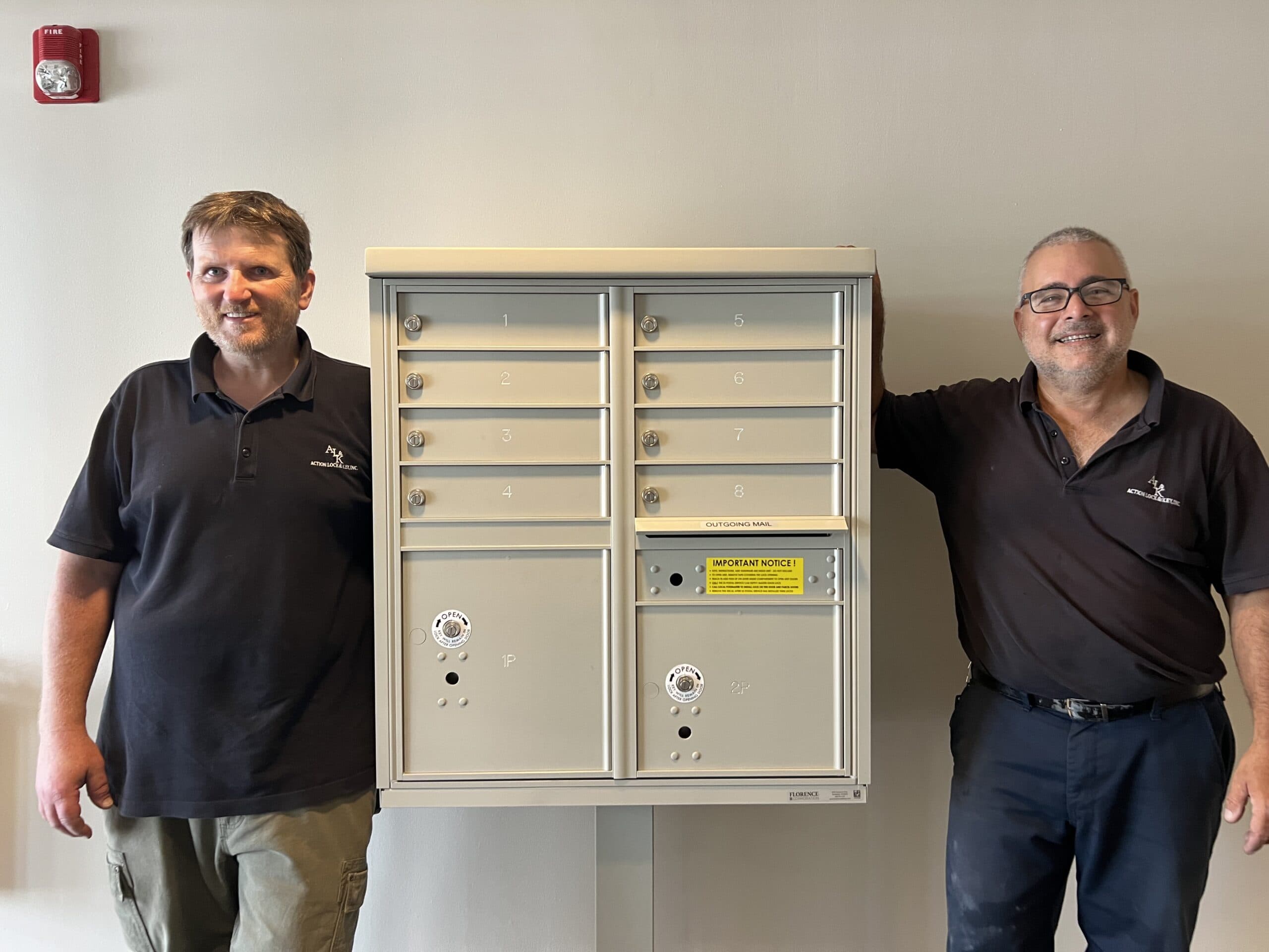 Action Lock & Key employees after commercial lock box installation in Boston, MA.